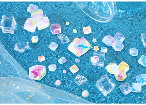 Macro shot of colorful aurora stickers with butterfly and star shapes for DIY journaling