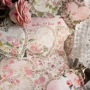 Vintage floral lace paper doilies with pink roses and delicate laser cut hollow edges