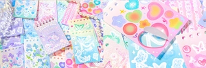 Close-up of pastel butterfly and heart stickers being peeled from the glitter sticker book