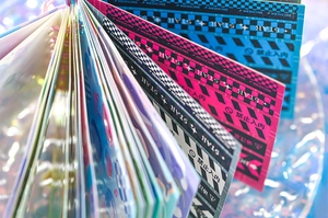 Detailed macro view of retro industrial style DIY journal stickers with holographic textures