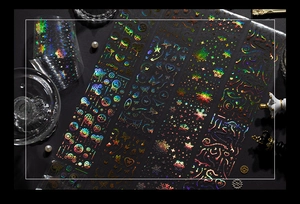 Detailed macro view of holographic PET tape featuring silver laser foil gear and butterfly designs