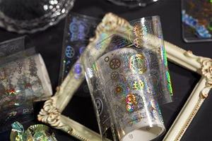 Macro detail of laser silver steampunk gear patterns on transparent PET deco tape