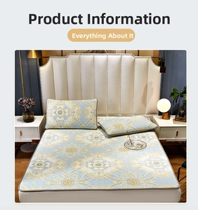 Close-up of light blue silk-like latex cooling mat with gold damask jacquard pattern