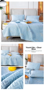 Detailed view of light blue ice silk latex mat with geometric quilting and grey piping