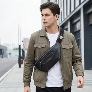 Close-up of genuine leather crossbody bag with multiple zippers and natural texture
