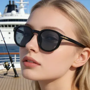 Close-up of retro black round polarized sunglasses with gold arrow metal detail on temple