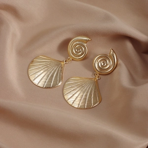 Bohemian gold seashell drop earrings featuring conch shell designs on champagne satin