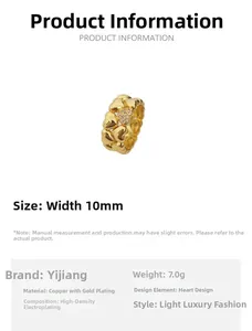Macro detail of vintage 18k gold plated heart ring with sparkling crystal accents