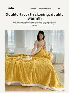 Close-up of thick double-sided yellow blanket with diamond texture and white fleece lining
