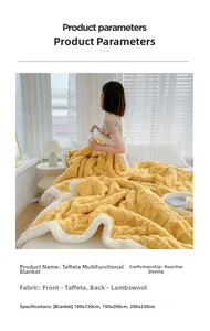Detail of yellow taffeta fleece and white sherpa double-sided thick warm blanket