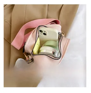 Pink PU crossbody bag interior showing storage space for phone and cosmetics