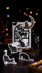 Detailed view of cat silhouette stickers featuring black cats and moon shapes for scrapbooking