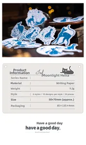Close-up of Moonlight Helia cat silhouette stickers on dark wood background textures