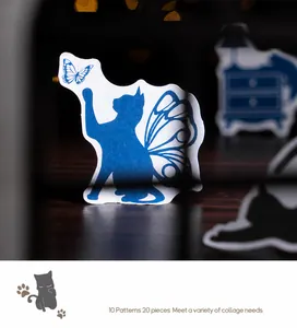 Macro shot of blue fantasy cat and butterfly stickers for DIY scrapbooking decoration