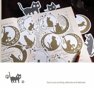 Detailed view of cat silhouettes with moon and stars for DIY journal decoration