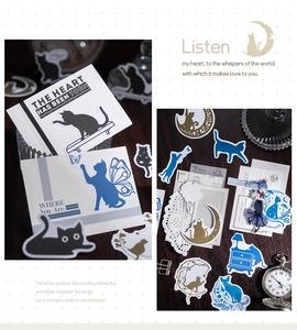 Detail of vintage cat silhouette stickers with gold foil and antique paper cards