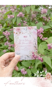 Close-up of vintage floral sticky notes with pink flower patterns and decorative text