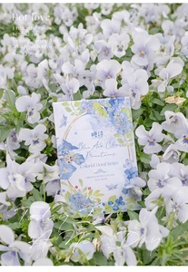 Detail showing vintage retro collage notebook with blue floral sketch on hardboard cover