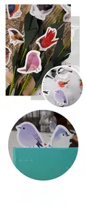 Close-up of bird illustration stickers with vintage newspaper and natural props
