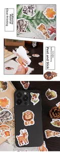 Macro detail of jungle animal stickers showing adhesive backing and phone application