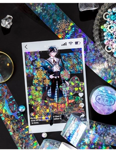 Macro shot of PET decorative tape with holographic silver snowflakes and anime character