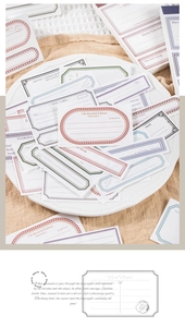 Detailed view of vintage frame stickers on linen for creative scrapbooking crafts