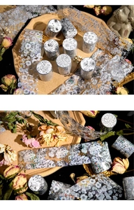 Detail of silver-stamped floral PET tape for DIY scrapbooking decoration