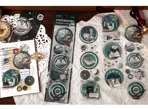 Detail of vintage astronomy stickers with globes and telescopes for DIY journaling