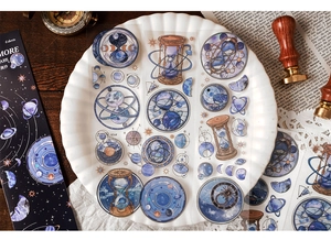 Detail of vintage celestial PET stickers featuring stars, hourglasses and planetary icons