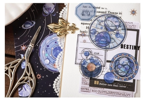 Detail of Galaxy series PET stickers with celestial planets and gold metal scissors