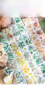 Detailed view of six decorative washi tapes featuring vibrant leaf and floral patterns