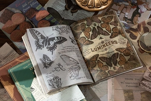 Detail of vintage butterfly scrapbooking paper with retro illustrations and floral elements