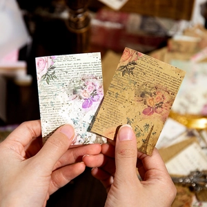 Carta decorativa vintage con motivi floreali, torre Eiffel e illustrazioni botaniche