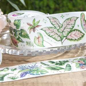 Plant themed decorative washi tape with green leaves pattern on a vintage tray
