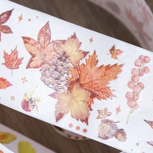 Autumn themed washi tape with maple leaves and pine cones for DIY scrapbooking