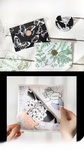 Detail of vintage floral scrapbooking paper set with butterfly prints and wax seal accents
