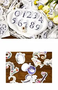 Dettaglio di adesivi floreali vintage con numeri 0-9 per decorazione fai-da-te
