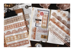 Macro shot of vintage lace hollow frames for DIY scrapbooking in retro brown tones