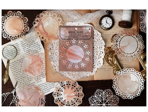 Detailed view of vintage lace paper scraps with hollow design for DIY journaling decor