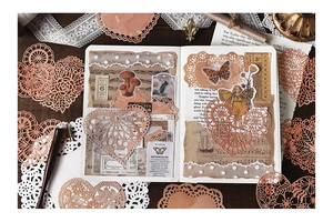 Detailed laser-cut vintage lace paper with terracotta red heart patterns for DIY scrapbooking