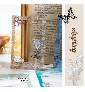 Macro shot of vintage botanical PET stickers with lilies and butterflies for journaling
