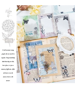 Close-up of vintage butterfly and floral PET stickers on antique paper for scrapbooking