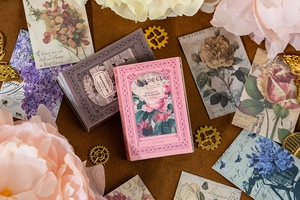 Macro view of vintage floral scrapbooking paper with elegant rose and violet patterns