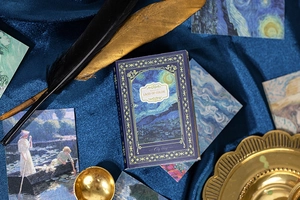 Detail of vintage Starry Night notebook with gold stamping and artistic scenery