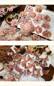 Macro detail of Sunset Forest vintage stickers with floral and butterfly patterns