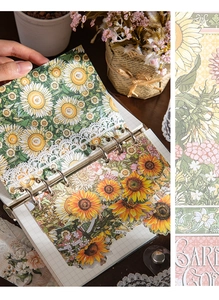 Dettaglio della carta da scrapbooking girasole vintage e adesivi floreali in pizzo