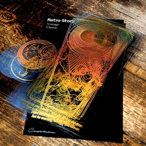 Retro zodiac PET stickers set with gold foil constellations and stars on a wooden surface