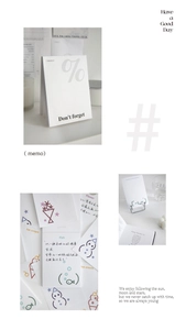 Close-up of minimalist paper sticky notes with symbolic illustrations and text for journaling