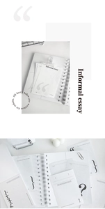 Close-up of minimalist stationery set with textured paper and sleek black symbol printing