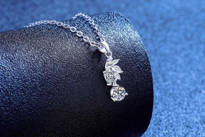 Close-up of S925 sterling silver necklace with marquise-cut gems and moissanite pendant